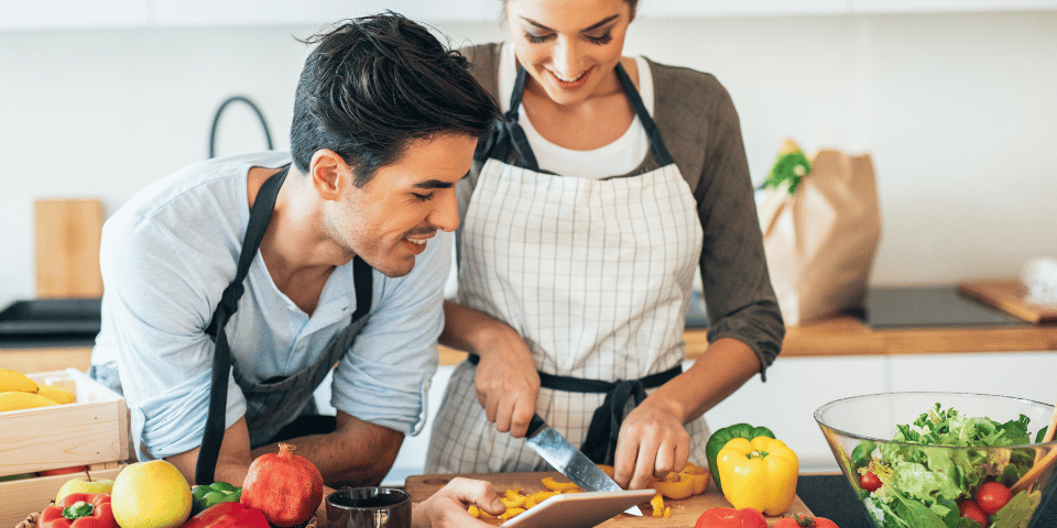 Young couple cooking together