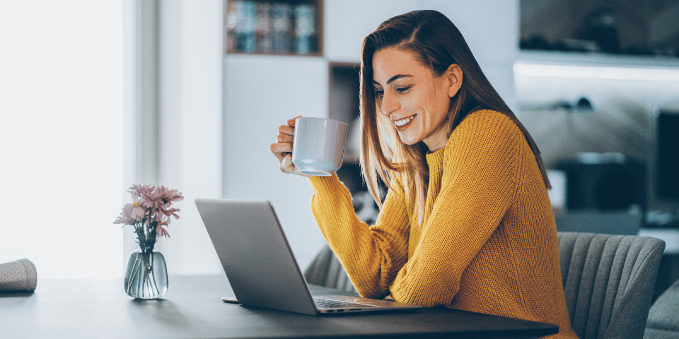 smiling woman reviewing checking account options online